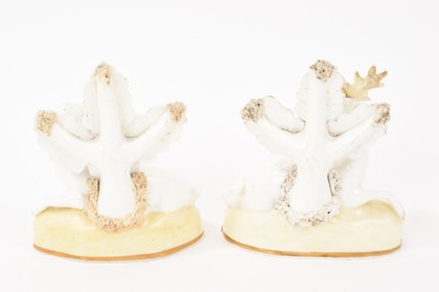 Lot 123 - Pair of Samuel Alcock porcelain figures of a doe and stag, circa 1830, sparsely decorated, shown seated on gilt-lined bases, 11.5cm high