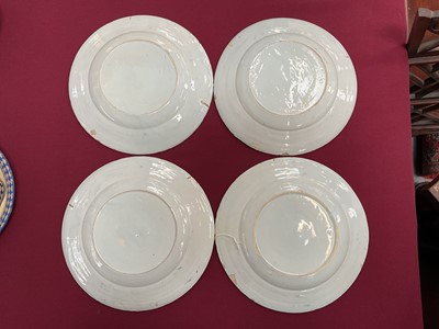 Lot 3 - Set of four 18th century Delft plates, polychrome painted in the Chinese style with a figure on a bridge near a pagoda, 23cm diameter