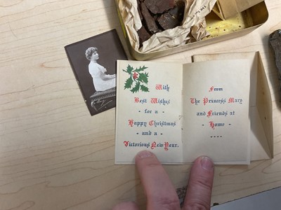 Lot 49 - First World War Princess Mary Gift Tin with original tobacco packet, Christmas card and photograph of Princess Mary. Together with pieces of shrapnel with annotation "HSB, bits of shell which bu...