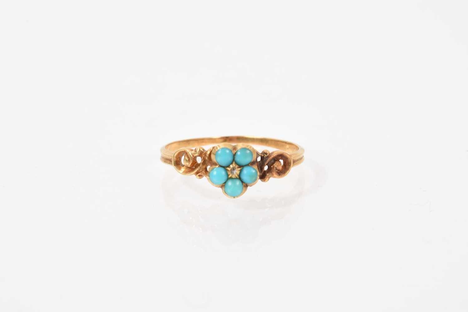 Lot 521 - Regency/early Victorian turquoise forget-me-not ring, the turquoise flower head cluster with a central rose cut diamond chip, carved scroll shoulders and glazed compartment to the reverse