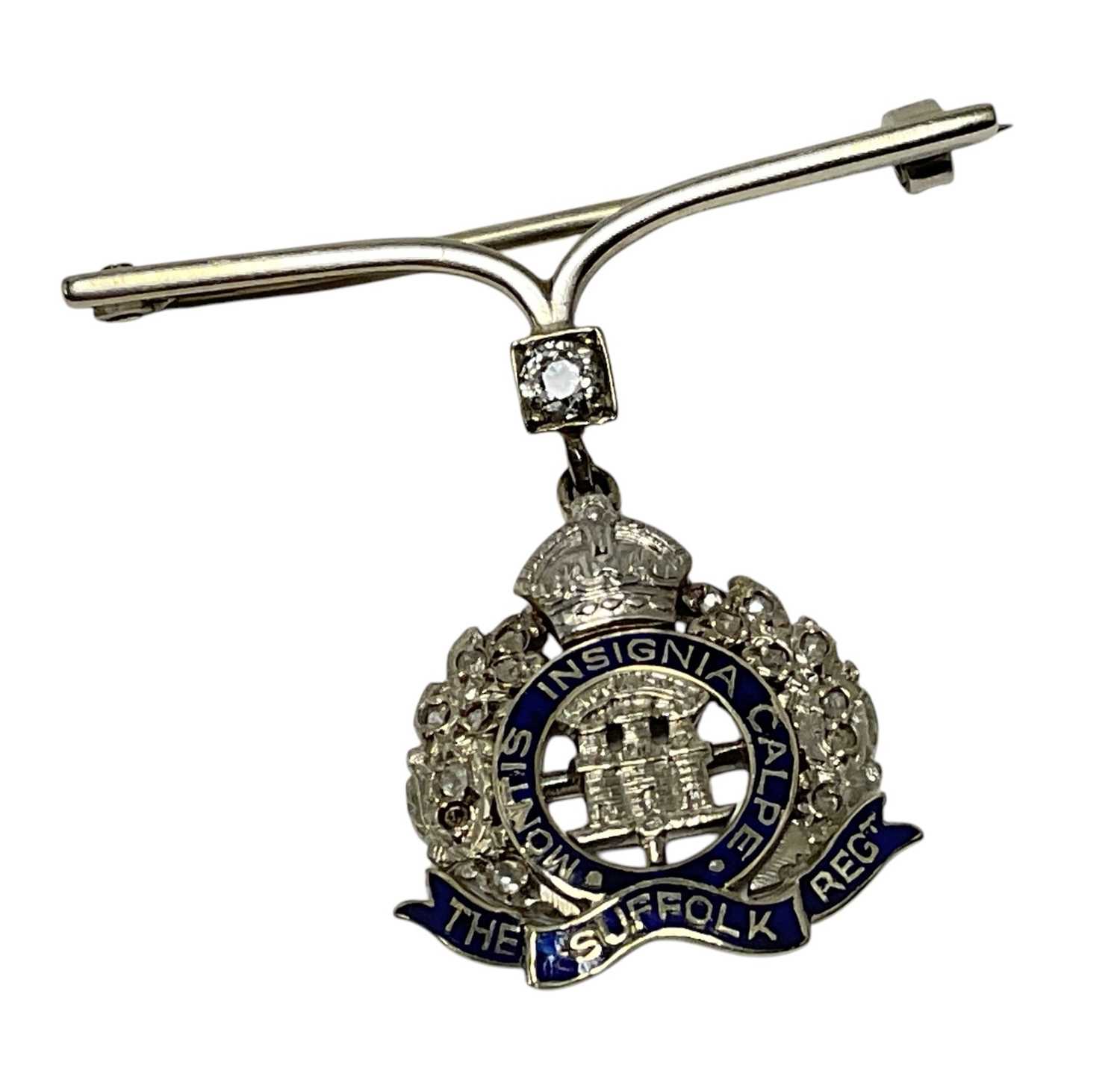 Lot 63 - Fine First World War Suffolk Regiment sweetheart brooch, bar set with central diamond with enamel and Rose cut diamond set regimental badge suspended on a pendant mount, set in yellow metal.
