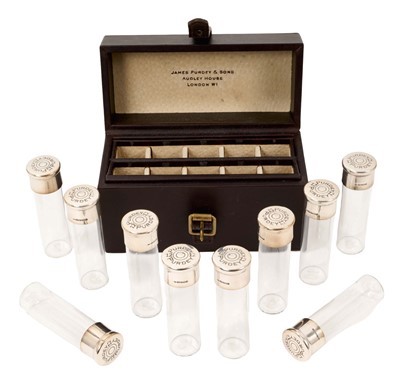 Lot 955 - James Purdy & Sons set of ten peg markers in the form of silver (925) topped 12 bore cartridges