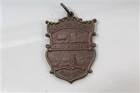 Lot 64 - South Africa - shield-shaped AE pendant...