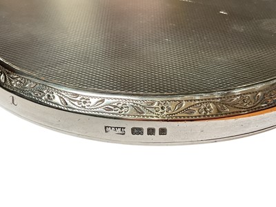 Lot 21 - Mappin & Webb silver jewellery box, matching silver backed dressing table mirror and silver mounted manicure set