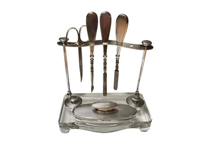 Lot 21 - Mappin & Webb silver jewellery box, matching silver backed dressing table mirror and silver mounted manicure set