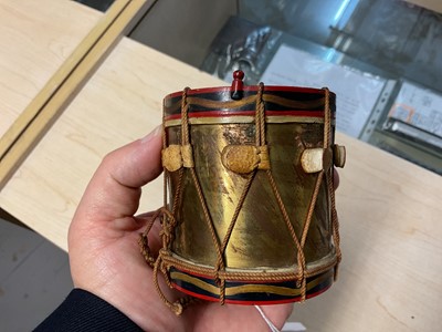 Lot 123 - Good quality early 20th century miniature Royal Artillery regimental drum with hand painted regimental badge and flags,7.9cm in overall height.