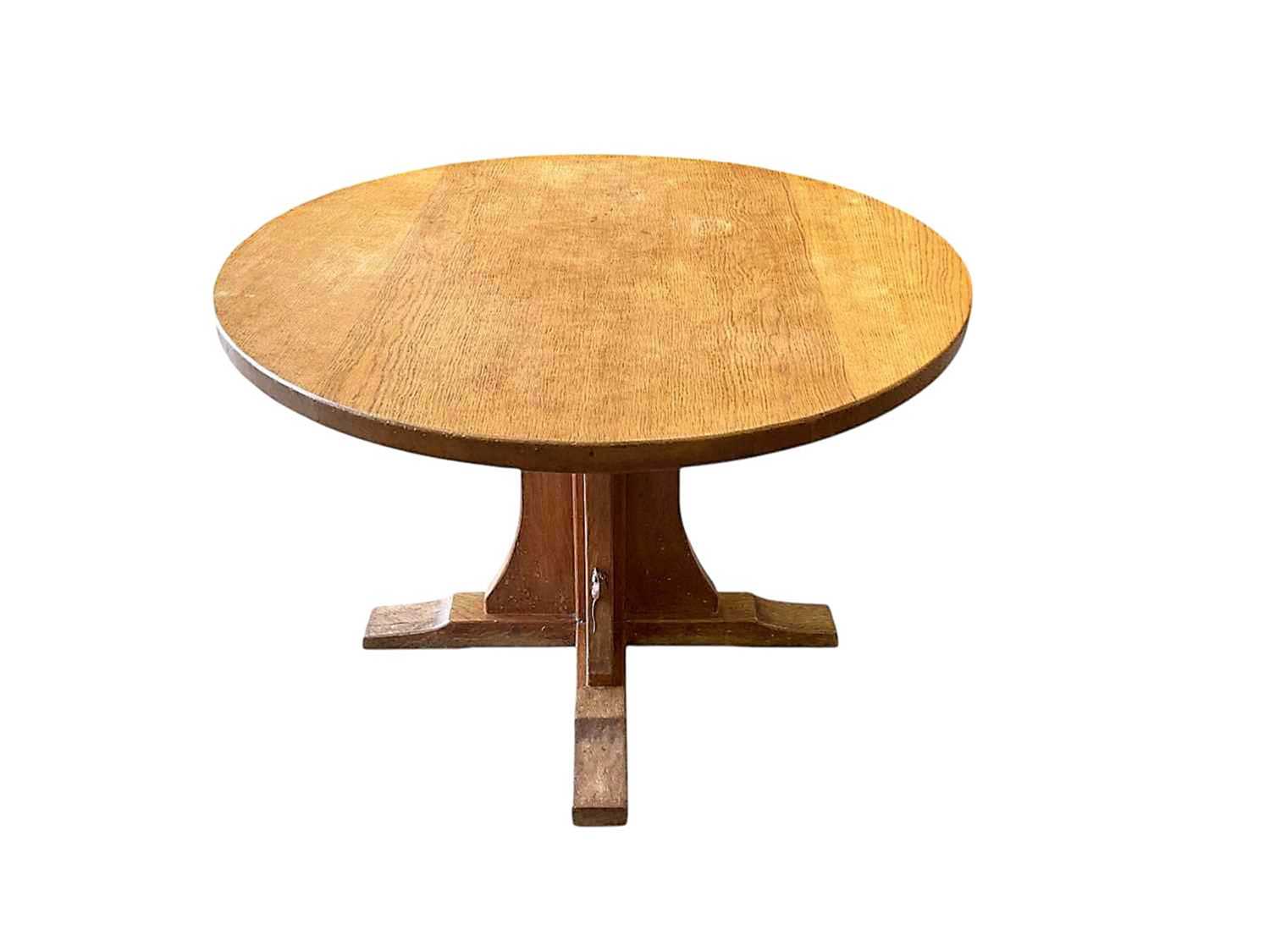 Lot 1513 - Robert 'Mouseman' Thompson oak breakfast table, with circular adzed top on quatreform pedestal base, 107cm diameter x 74cm high