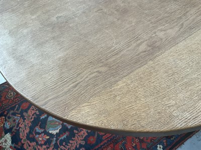 Lot 1513 - Robert 'Mouseman' Thompson oak breakfast table, with circular adzed top on quatreform pedestal base, 107cm diameter x 74cm high