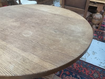 Lot 1513 - Robert 'Mouseman' Thompson oak breakfast table, with circular adzed top on quatreform pedestal base, 107cm diameter x 74cm high