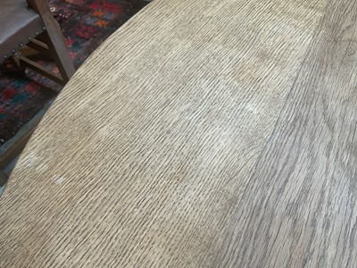 Lot 1513 - Robert 'Mouseman' Thompson oak breakfast table, with circular adzed top on quatreform pedestal base, 107cm diameter x 74cm high