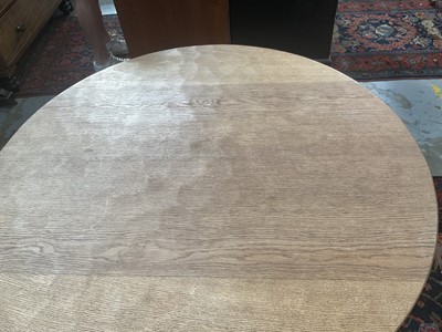 Lot 1513 - Robert 'Mouseman' Thompson oak breakfast table, with circular adzed top on quatreform pedestal base, 107cm diameter x 74cm high