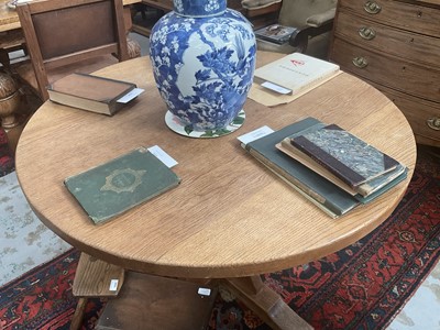 Lot 1513 - Robert 'Mouseman' Thompson oak breakfast table, with circular adzed top on quatreform pedestal base, 107cm diameter x 74cm high