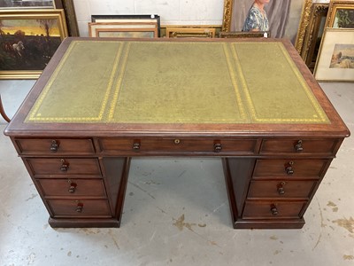 Lot 1512 - Early Victorian mahogany partners desk, with leather inset top and nine drawers to the kneehole with three drawers and twin cupboards to opposing kneehole, on plinth bases, 152cm wide x 99cm dee...