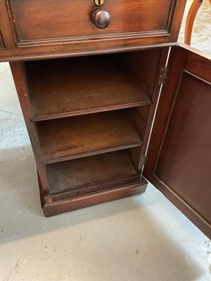 Lot 1512 - Early Victorian mahogany partners desk, with leather inset top and nine drawers to the kneehole with three drawers and twin cupboards to opposing kneehole, on plinth bases, 152cm wide x 99cm dee...