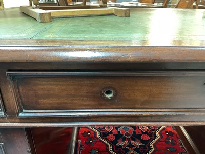 Lot 1512 - Early Victorian mahogany partners desk, with leather inset top and nine drawers to the kneehole with three drawers and twin cupboards to opposing kneehole, on plinth bases, 152cm wide x 99cm dee...