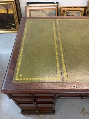 Lot 1512 - Early Victorian mahogany partners desk, with leather inset top and nine drawers to the kneehole with three drawers and twin cupboards to opposing kneehole, on plinth bases, 152cm wide x 99cm dee...