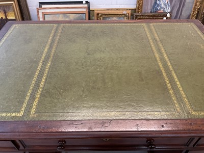Lot 1512 - Early Victorian mahogany partners desk, with leather inset top and nine drawers to the kneehole with three drawers and twin cupboards to opposing kneehole, on plinth bases, 152cm wide x 99cm dee...