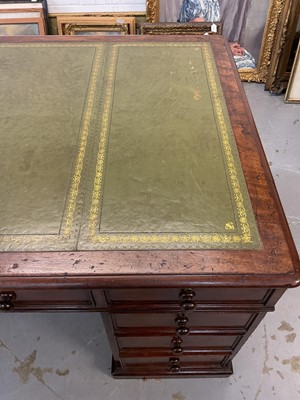 Lot 1512 - Early Victorian mahogany partners desk, with leather inset top and nine drawers to the kneehole with three drawers and twin cupboards to opposing kneehole, on plinth bases, 152cm wide x 99cm dee...