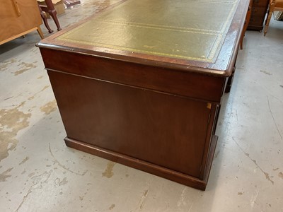 Lot 1512 - Early Victorian mahogany partners desk, with leather inset top and nine drawers to the kneehole with three drawers and twin cupboards to opposing kneehole, on plinth bases, 152cm wide x 99cm dee...