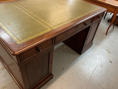 Lot 1512 - Early Victorian mahogany partners desk, with leather inset top and nine drawers to the kneehole with three drawers and twin cupboards to opposing kneehole, on plinth bases, 152cm wide x 99cm dee...