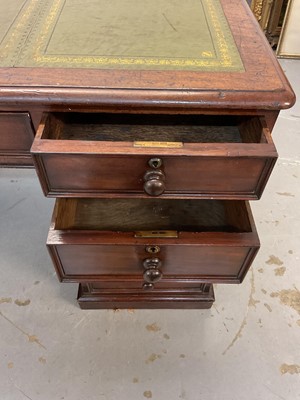 Lot 1512 - Early Victorian mahogany partners desk, with leather inset top and nine drawers to the kneehole with three drawers and twin cupboards to opposing kneehole, on plinth bases, 152cm wide x 99cm dee...