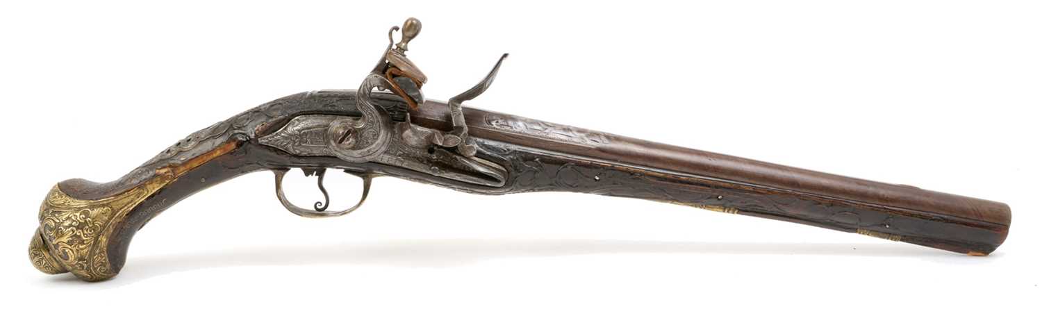 Lot 157 - 19th century Balkan/ Turkish flintlock holster pistol with ornate brass and steel mounts, carved walnut and silver wire inlaid stock 50cm overall