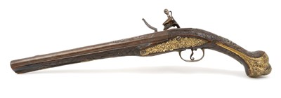 Lot 157 - 19th century Balkan/ Turkish flintlock holster pistol with ornate brass and steel mounts, carved walnut and silver wire inlaid stock 50cm overall