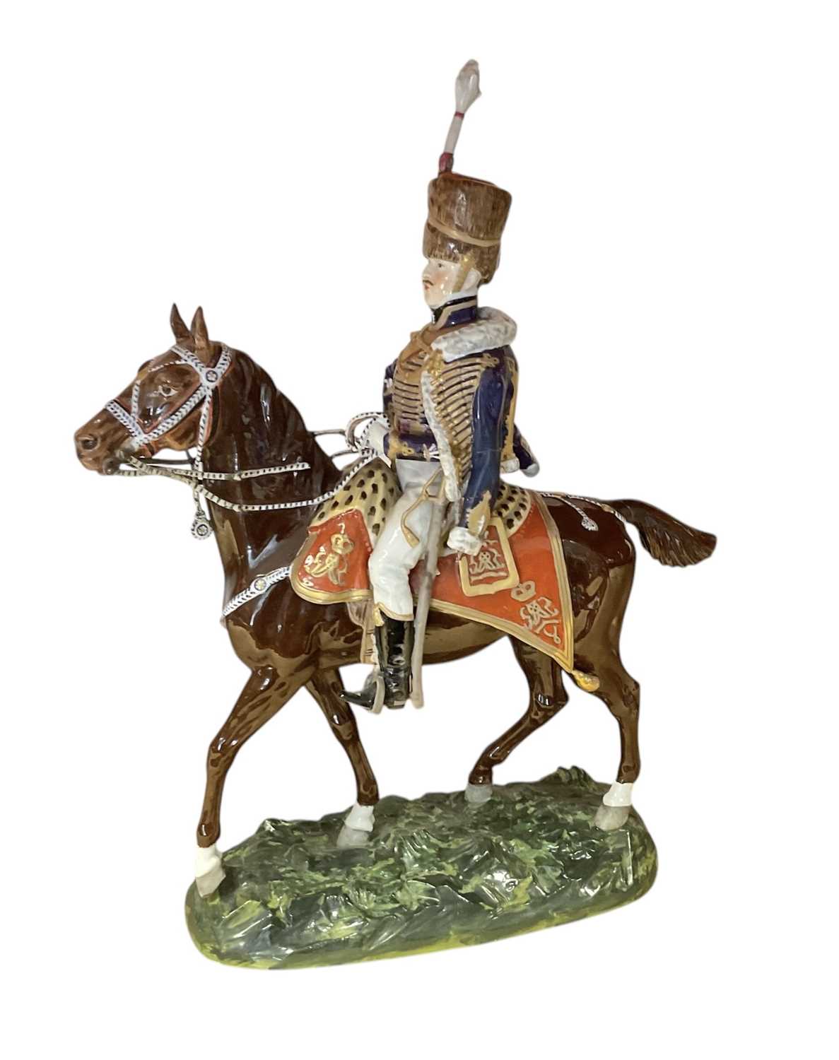 Lot 133 - Good quality Dresden porcelain military equestrian figure of a mounted Napoleonic period British Hussar Officer on naturalistic base, marked underneath ' 1815 10th Hussars' and 'Made in Dr...