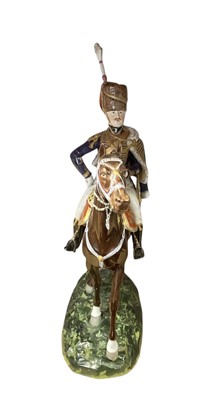 Lot 133 - Good quality Dresden porcelain military equestrian figure of a mounted Napoleonic period British Hussar Officer on naturalistic base, marked underneath ' 1815 10th Hussars' and 'Made in Dr...