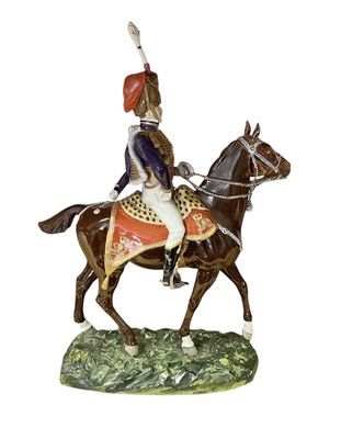 Lot 133 - Good quality Dresden porcelain military equestrian figure of a mounted Napoleonic period British Hussar Officer on naturalistic base, marked underneath ' 1815 10th Hussars' and 'Made in Dr...