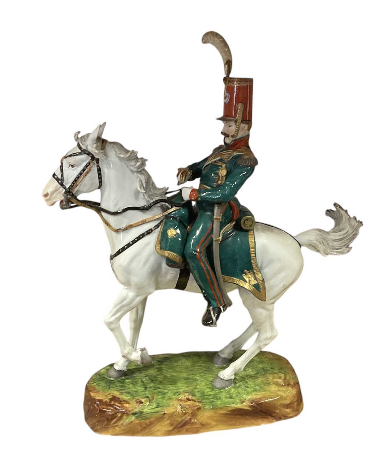 Lot 134 - Good quality Dresden porcelain military equestrian figure of French Napoleonic Cavalry Officer on naturalistic base, marked underneath' Majeur des Eclaireurs' and ' Made in Dresden' 38cm
