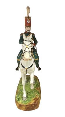 Lot 134 - Good quality Dresden porcelain military equestrian figure of French Napoleonic Cavalry Officer on naturalistic base, marked underneath' Majeur des Eclaireurs' and ' Made in Dresden' 38cm