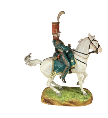 Lot 134 - Good quality Dresden porcelain military equestrian figure of French Napoleonic Cavalry Officer on naturalistic base, marked underneath' Majeur des Eclaireurs' and ' Made in Dresden' 38cm