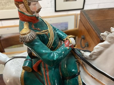 Lot 134 - Good quality Dresden porcelain military equestrian figure of French Napoleonic Cavalry Officer on naturalistic base, marked underneath' Majeur des Eclaireurs' and ' Made in Dresden' 38cm