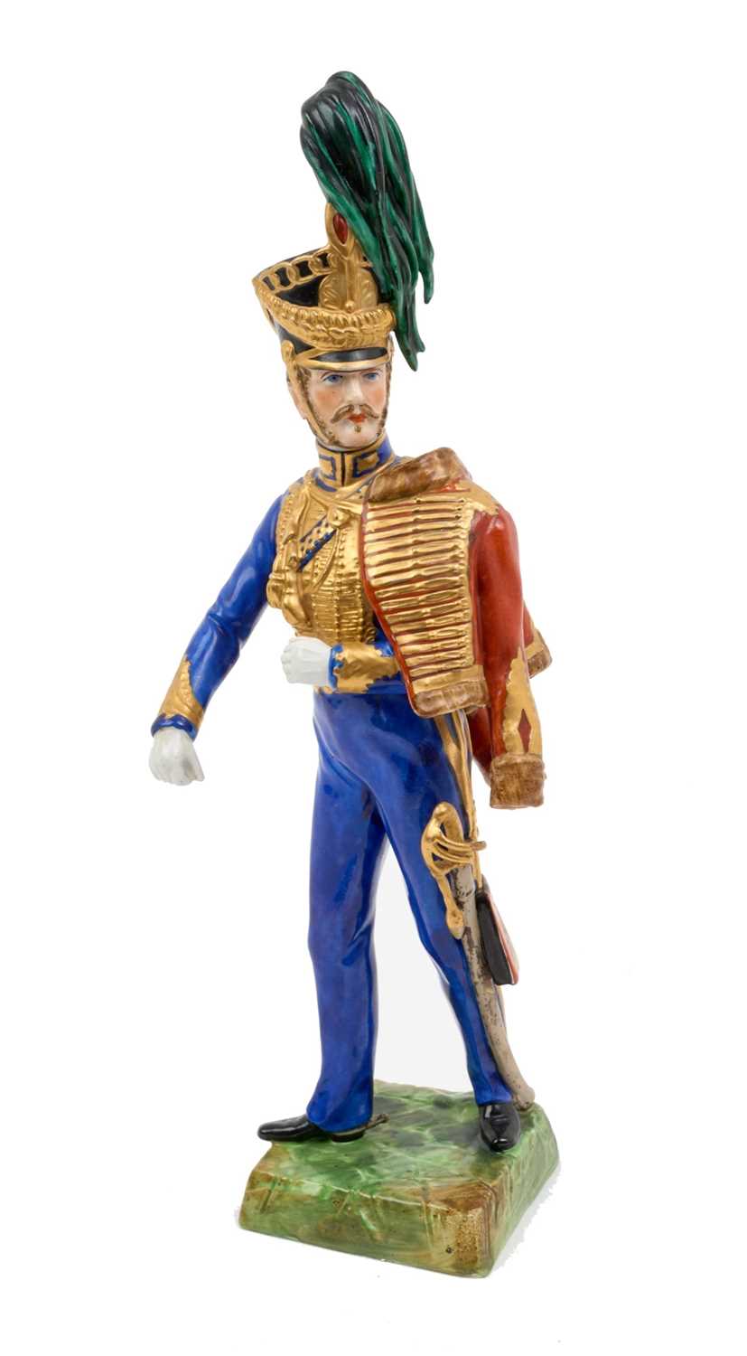 Lot 137 - Good quality Dresden porcelain military figure of a British Napoleonic period Hussar Officer marked on underside ' 10th Royal Regt.Hussars' and 'Made at Dresden ' 30cm high