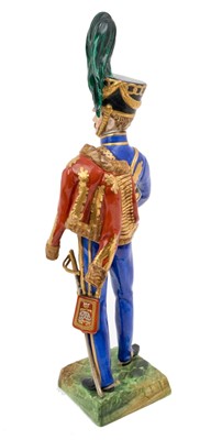 Lot 137 - Good quality Dresden porcelain military figure of a British Napoleonic period Hussar Officer marked on underside ' 10th Royal Regt.Hussars' and 'Made at Dresden ' 30cm high