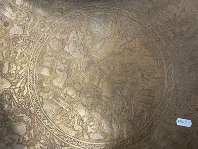 Lot 205 - Two large Persian embossed brass chargers, 58cm diameter