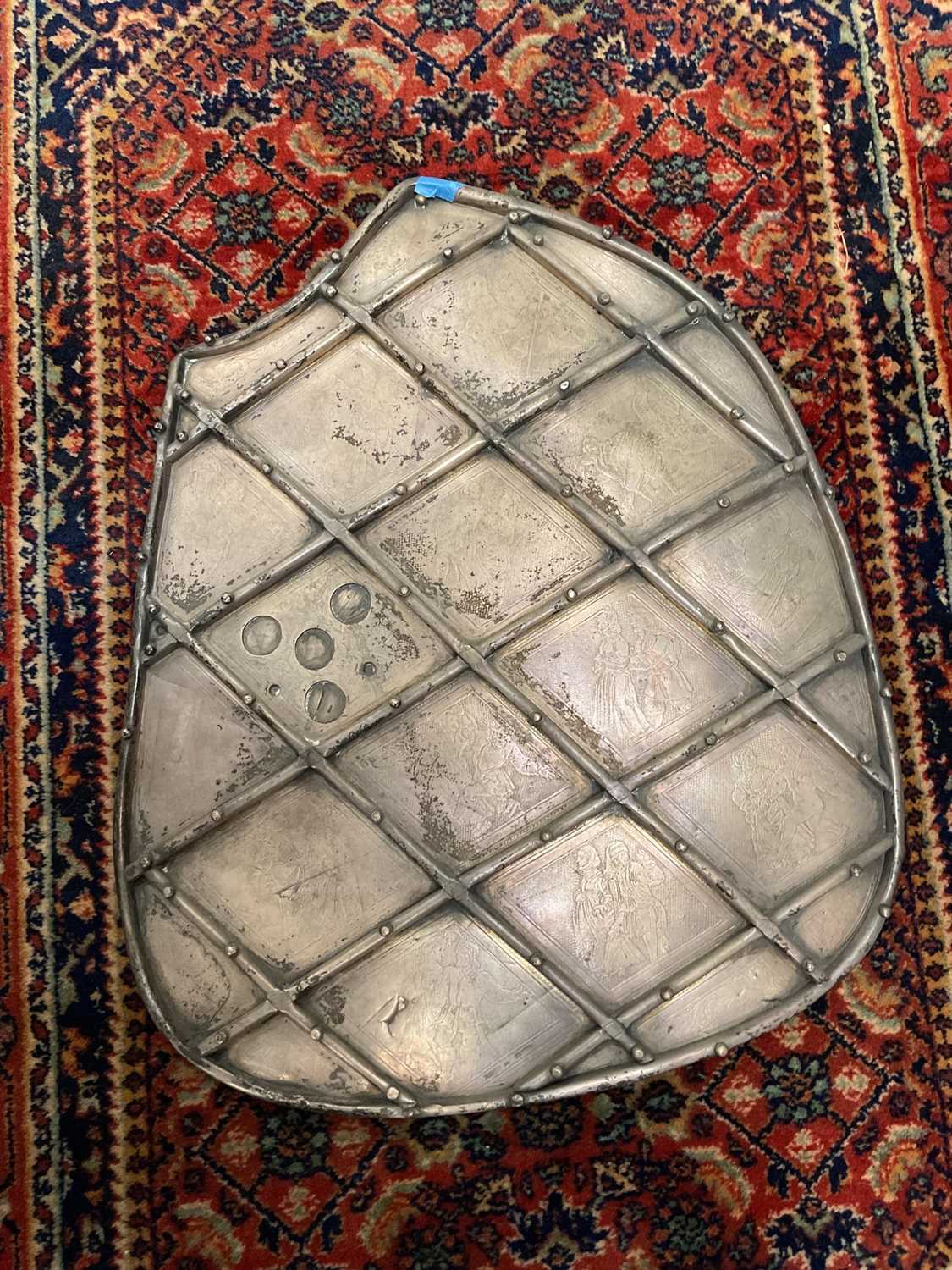 Lot 109 - A jousting shield with figural decoration