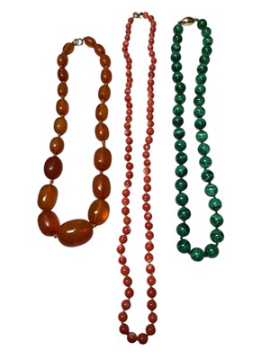 Lot 40 - Vintage amber bead necklace, vintage coral bead necklace and a malachite bead necklace