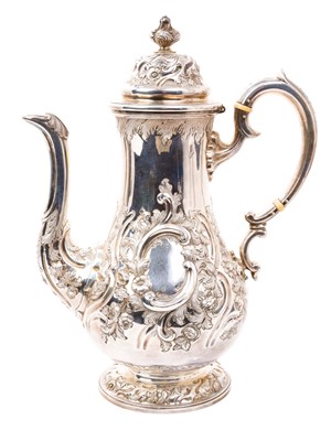 Lot 412 - Victorian Scottish silver coffee pot of baluster form, with embossed scroll and foliate decoration