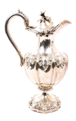 Lot 413 - Victorian silver hot water jug of baluster form, with embossed foliate decoration