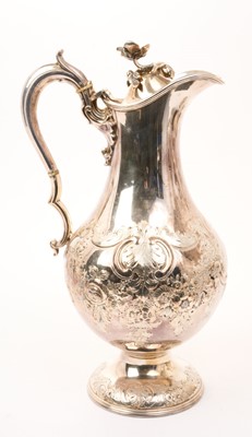 Lot 414 - Victorian silver plated hot water jug of baluster form, with embossed floral decoration