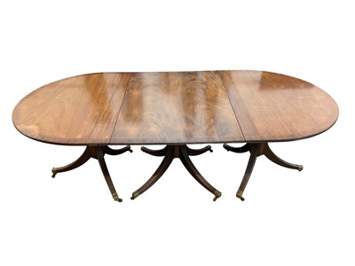 Lot 1355 - Georgian style mahogany three pedestal extending dining table with extra leaves