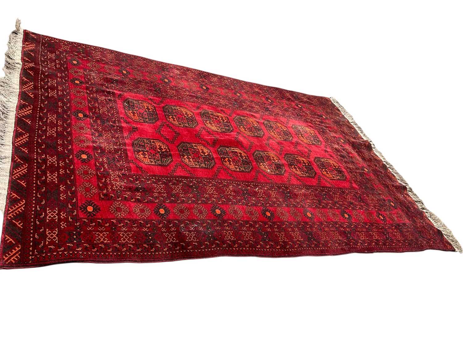 Lot 1635 - Turkoman rug with two rows of six quartered medallions