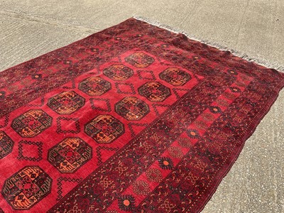 Lot 1635 - Turkoman rug with two rows of six quartered medallions