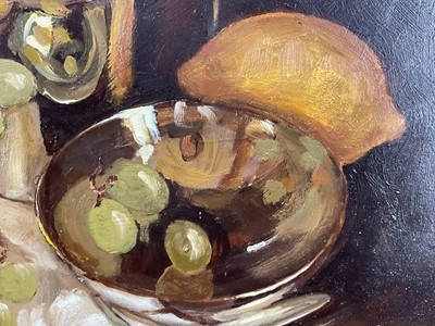 Lot 17 - Ruth Bowyer, contemporary, oil on board - Still Life Grapes and Lemons, 29cm x 39.5cm, signed, in gilt frame