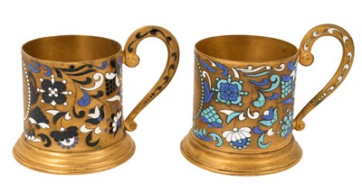 Lot 997 - Two Russian gilt metal and enamelled cup holders