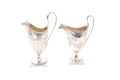 Lot 589 - Two Georgian silver helmet shaped cream jugs with beaded borders, 6 ozs