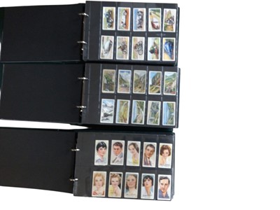 Lot 1162 - Collection of cigarette cards in albums (2 boxes) including Players, Wills, 1930's issues, Nostalgia issues etc.