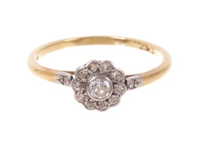 Lot 686 - Edwardian diamond cluster ring with a daisy cluster of old cut diamonds in platinum setting on 18ct gold shank